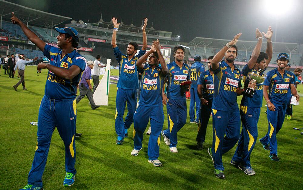 Sri Lankan cricketers acknowledge the crowd after winning the Asia Cup final match against Pakistan in Dhaka, Bangladesh.