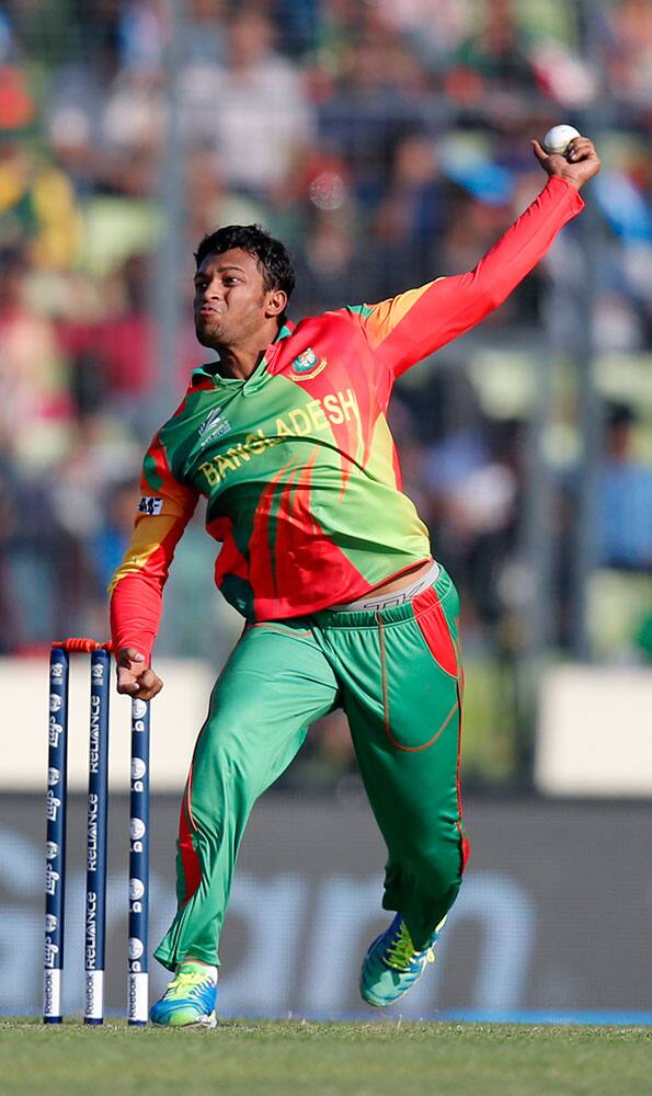 Bangladesh's bowler Shakib Al Hasan bowls during their ICC Twenty20 Cricket World Cup opening match against Afghanistan in Dhaka.