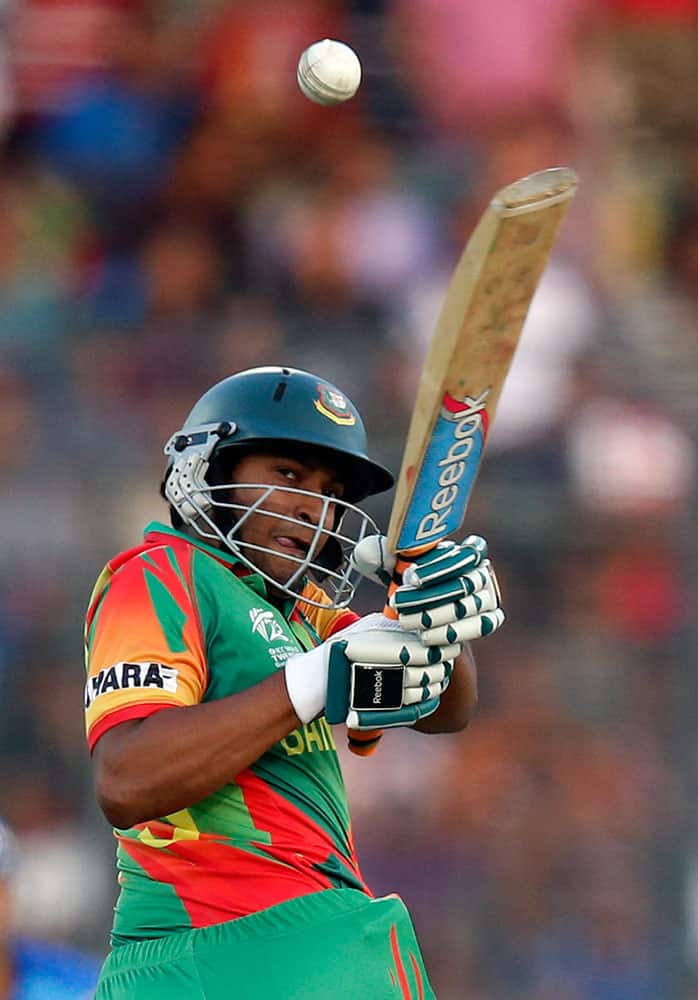 Bangladesh's batsman Shakib Al Hasan plays a shot during their ICC Twenty20 Cricket World Cup opening match against Afghanistan in Dhaka.
