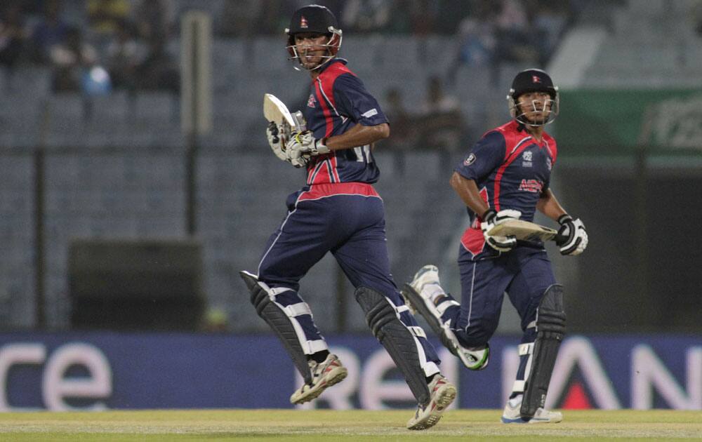 ICC World Twenty20 2014: Nepal captain Paras Khadka, left and Gyanendra Malla run between the wickets against Hong Kong in Chittagong (March 16, 2014)