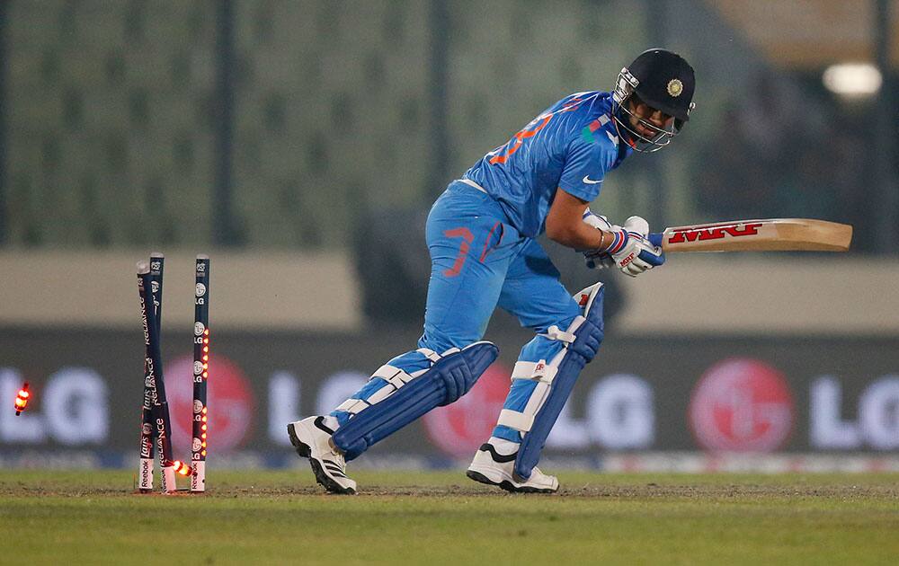 India's batsman Virat Kohli is bowled out during their ICC Twenty20 Cricket World Cup warm up match against Sri Lanka in Dhaka, Bangladesh.