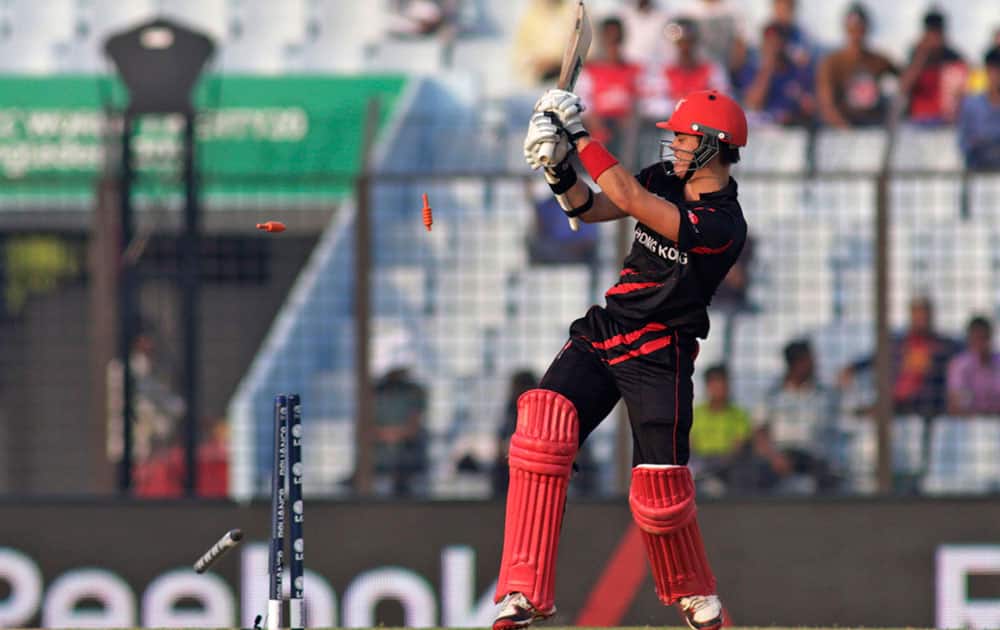Hong Kong's Mark Chapman is bowled out during their ICC Twenty20 Cricket World Cup match against Afghanistan in Chittagong, Bangladesh.