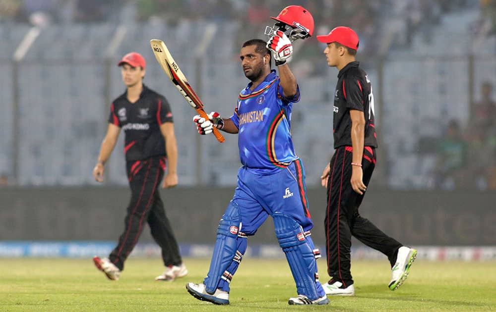 Afghanistan batsman Mohammad Shahzad acknowledges the crowd after scoring fifty runs during their ICC Twenty20 Cricket World Cup match against Hong Kong in Chittagong, Bangladesh.