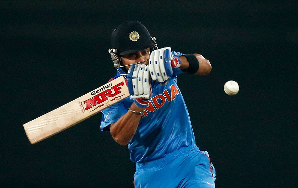 Virat Kohli plays a shot during their ICC Twenty20 Cricket World Cup warm up match against England in Dhaka, Bangladesh.