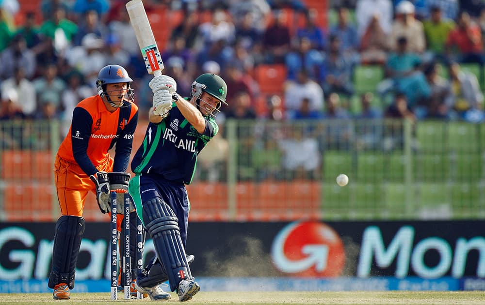 Ireland's Ed Joyce, right, plays a shot in front of the Netherlands' wicketkeeper Wesley Barresi during the ICC Twenty20 Cricket World Cup match between them in Sylhet, Bangladesh.