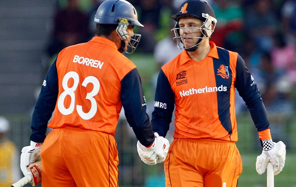 Netherlands' Stephan Myburgh, right, celebrates with captain Peter Borren after scoring a half century during the ICC Twenty20 Cricket World Cup match against Ireland in Sylhet, Bangladesh.