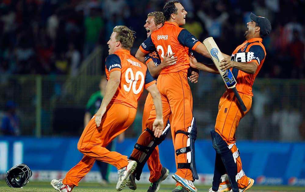 Netherlands' players celebrate their win against Ireland during the ICC Twenty20 Cricket World Cup match in Sylhet, Bangladesh.