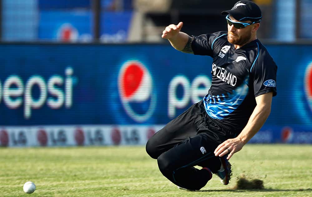 New Zealand's captain Brendon McCullum drives as he fields during their ICC Twenty20 Cricket World Cup match against South Africa, in Chittagong, Bangladesh.