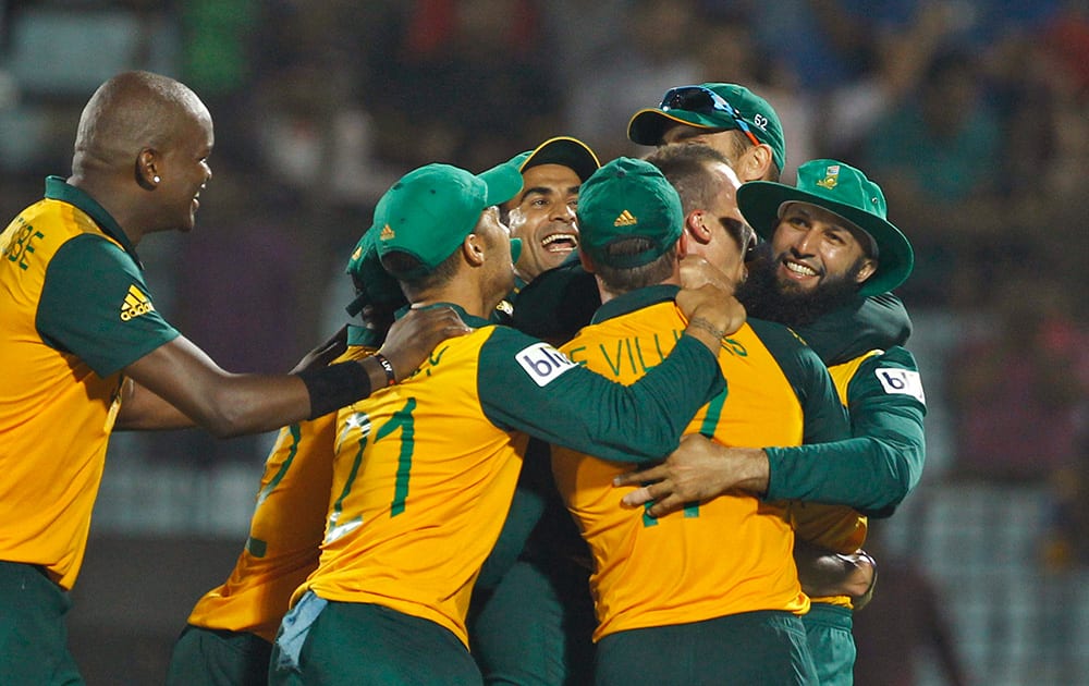 South Africa's players celebrate after defeating New Zealand in their ICC Twenty20 Cricket World Cup match in Chittagong, Bangladesh.