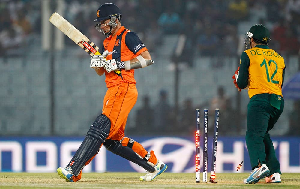 The bails fly off the wickets resulting in the dismissal of Netherlands' Tom Cooper during the ICC Twenty20 Cricket World Cup match against South Africa in Chittagong, Bangladesh.