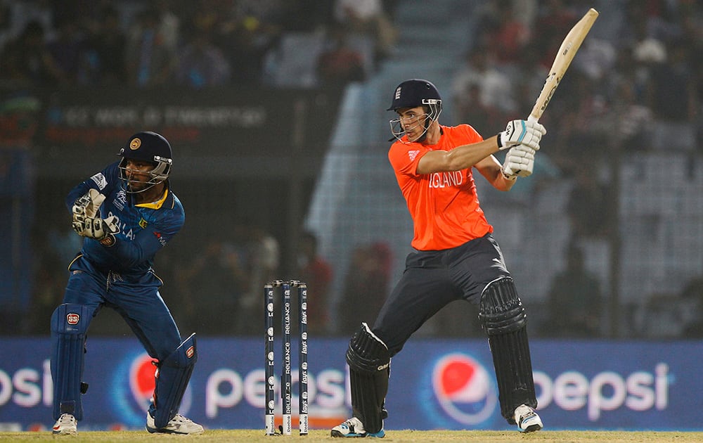 England's Alex Hales plays a shot, as Sri Lanka's Kumar Sangakkara follows the ball during their ICC Twenty20 Cricket World Cup match in Chittagong, Bangladesh.