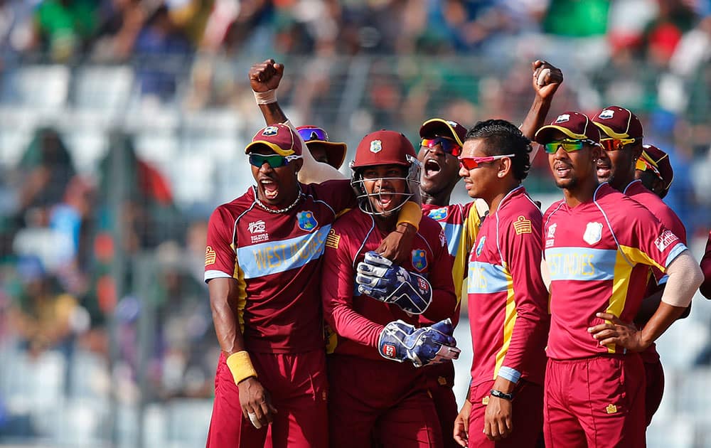 West Indies' players celebrate the dismissal of Australia's batsman Shane Watson during their ICC Twenty20 Cricket World Cup match in Dhaka, Bangladesh.