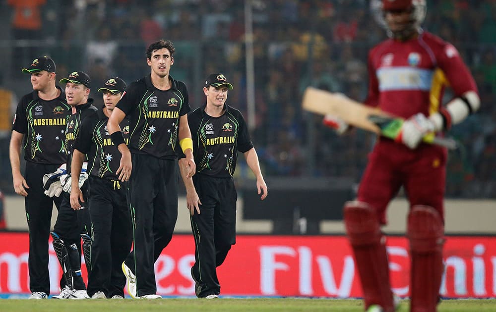 Australia's bowler Mitchell Starc celebrates with teammates the dismissal of West Indies' batsman Marlon Samuels during their ICC Twenty20 Cricket World Cup match in Dhaka, Bangladesh.