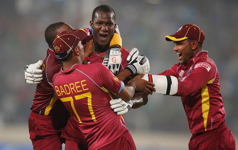 West Indies' captain Darren Sammy celebrates with teammates their win over Australia in the ICC Twenty20 Cricket World Cup match in Dhaka, Bangladesh.