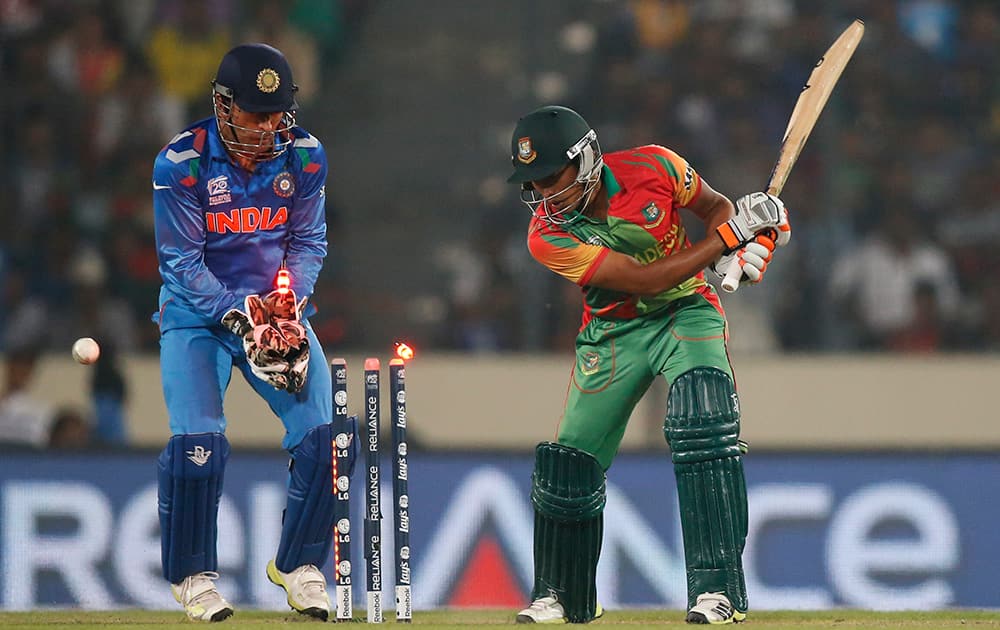 Bangladesh batsman Anamul Haque is bowled out by India's Amit Mishra during their ICC Twenty20 Cricket World Cup match in Dhaka, Bangladesh.