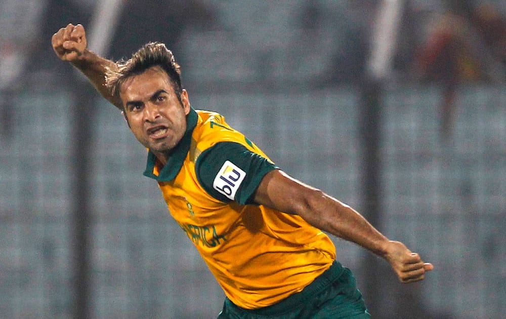 South Africa's Imran Tahir celebrates the dismissal of England's Eoin Morgan during their ICC Twenty20 Cricket World Cup match in Chittagong, Bangladesh.