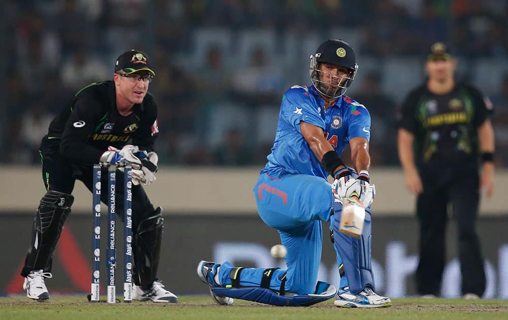 India's batsman Yuvraj Singh, center, plays a shot during their ICC Twenty20 Cricket World Cup match against Australia in Dhaka, Bangladesh.
