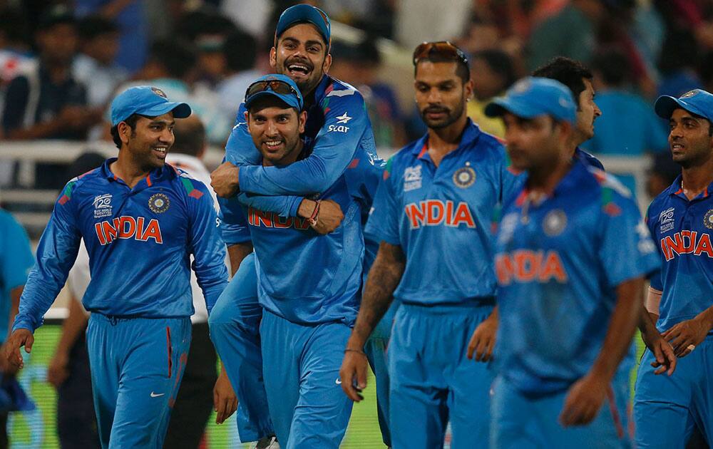 India's Yuvraj Singh, second left, carries teammate Virat Kohli on his back as they celebrate their win over Australia in their ICC Twenty20 Cricket World Cup match in Dhaka, Bangladesh.