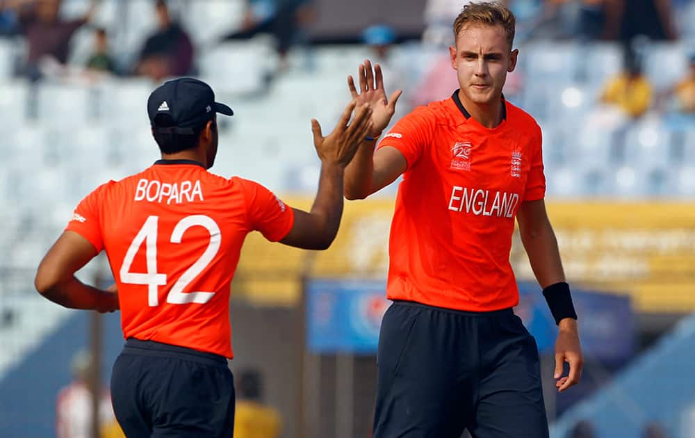 England's captain Stuart Broad celebrates with his teammate Ravi Bopara after taking the wicket of Netherlands' Michael Swart during the ICC Twenty20 Cricket World Cup match between them in Chittagong, Bangladesh.