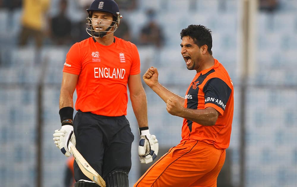 Netherlands's Mudassar Bukhari celebrates the wicket of England's Michael Lumb during their ICC Twenty20 Cricket World Cup match in Chittagong, Bangladesh.