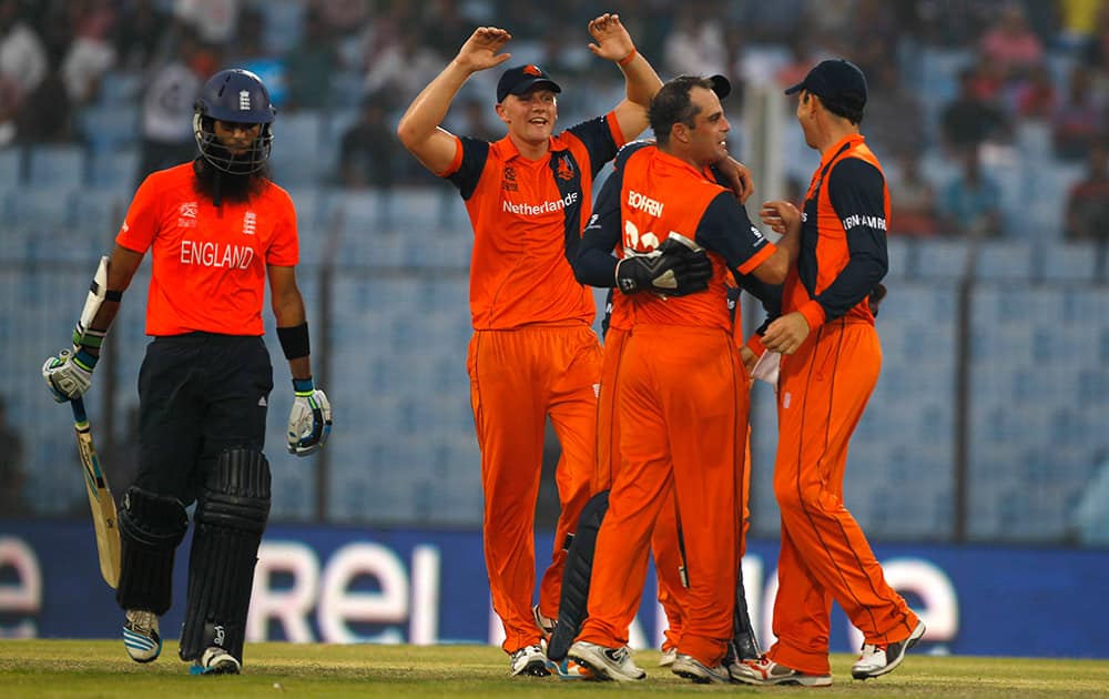 Netherlands's captain Peter Borren celebrates with his teammates the wicket of England's Moeen Ali during their ICC Twenty20 Cricket World Cup match in Chittagong, Bangladesh.