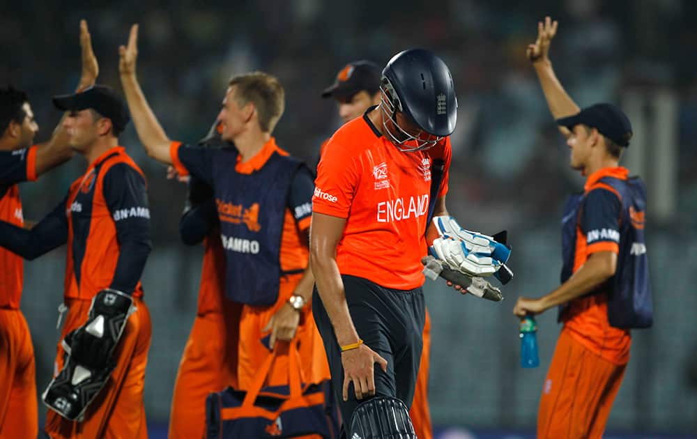 England's captain Stuart Broad walks back to the pavilion after his dismissal by Netherlands's Mudassar Bukhari during their ICC Twenty20 Cricket World Cup in Chittagong, Bangladesh.