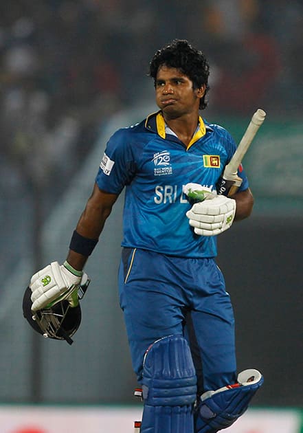Sri Lanka's Kusal Perera walks back to the pavilion after his dismissal by New Zealand's Trent Boult during their ICC Twenty20 Cricket World Cup match in Chittagong, Bangladesh.