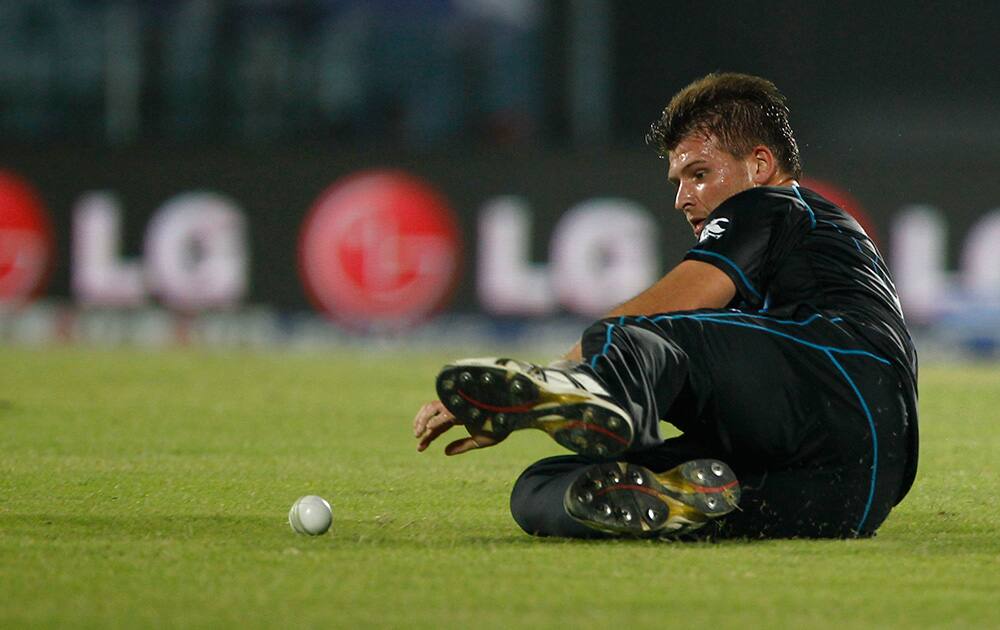 New Zealand's Corey Anderson drives to stop the ball as he fields against Sri Lanka during their ICC Twenty20 Cricket World Cup match in Chittagong, Bangladesh.