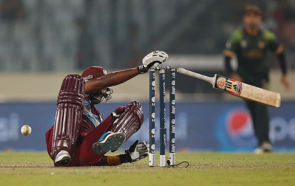 West Indies' batsman Dwayne Bravo falls on the ground after he was hit by the ball during their ICC Twenty20 Cricket World Cup match against Pakistan in Dhaka, Bangladesh.
