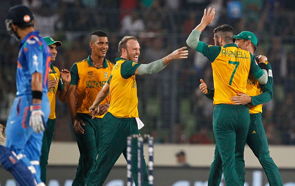 South Africa's players clebrate the dismissal of India's Ajinkya Rahane during their ICC Twenty20 Cricket World Cup semifinal match in Dhaka, Bangladesh.