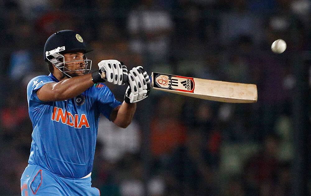 India's Suresh Raina plays a shot during their ICC Twenty20 Cricket World Cup semifinal match against South Africa in Dhaka, Bangladesh.