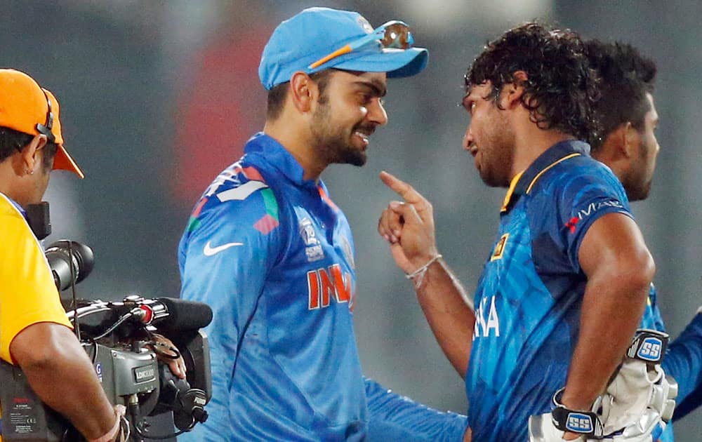 India's Virat Kohli, center, greets Sri Lanka's Kumar Sangakkara, front right, after Sri Lanka's win in the ICC Twenty20 Cricket World Cup final match in Dhaka.
