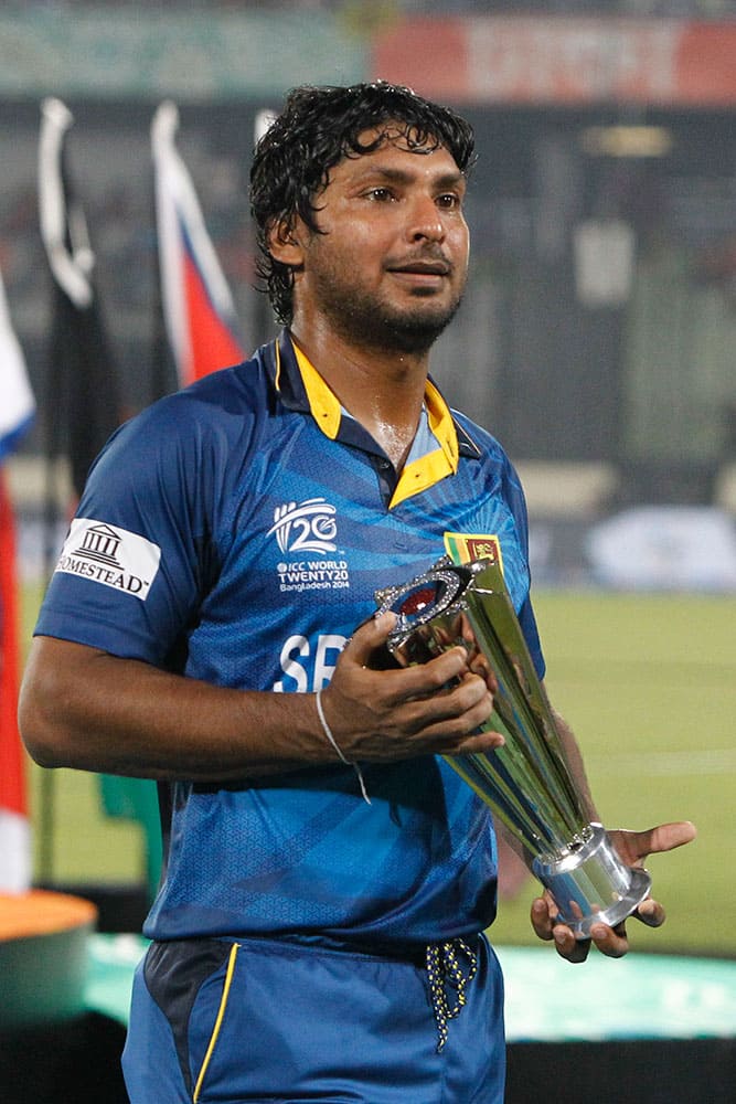 Sri Lanka’s Kumar Sangakkara holds the Man of the match trophy after winning the ICC Twenty20 Cricket World Cup final match in Dhaka.