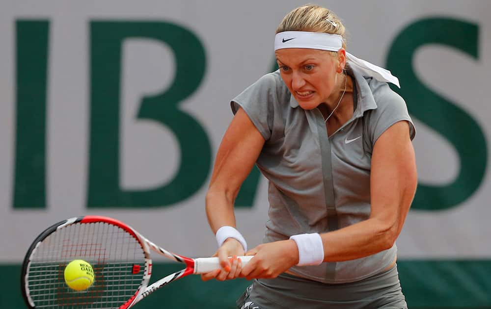 Petra Kvitova of the Czech Republic returns the ball to Kazakhstan's Zarina Diyas during the first round match of the French Open tennis tournament at the Roland Garros stadium, in Paris.