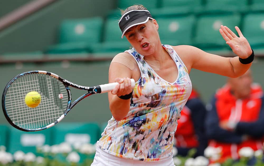 Russia's Alisa Kleybanova returns the ball to Romania's Simona Halep in the first round match of the French Open tennis tournament at the Roland Garros stadium, in Paris, France.