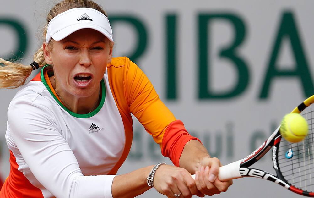 Denmark's Caroline Wozniacki returns the ball during the first round match of the French Open tennis tournament against Belgium's Yanina Wickmayer at the Roland Garros stadium, in Paris, France.