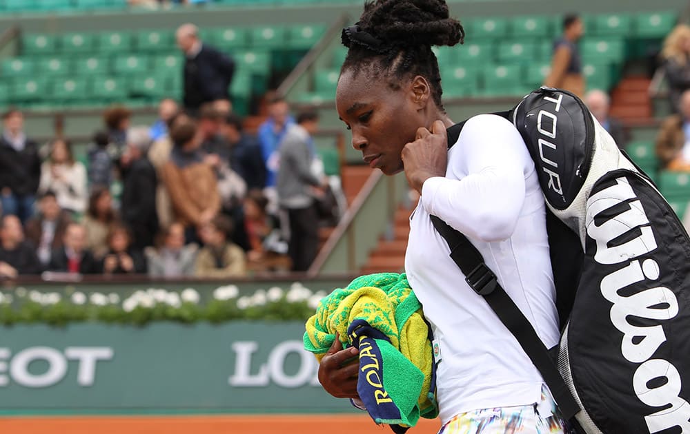 Venus Williams of the U.S. leaves after losing her second round match of the French Open tennis tournament in three sets against Slovakia's Anna Schmiedlova at the Roland Garros stadium, in Paris, France.