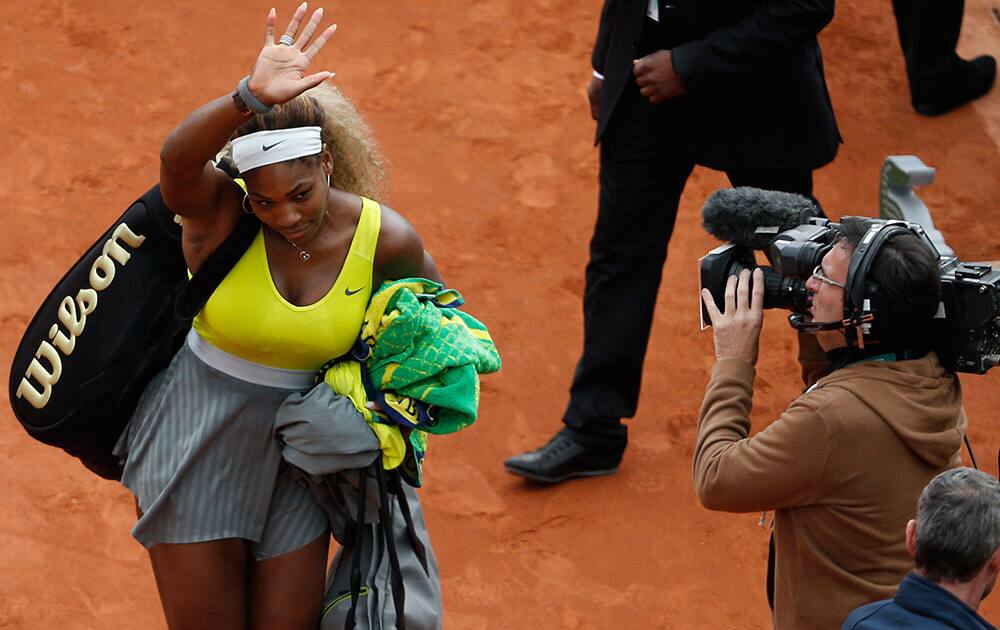 Serena Williams of the U.S. leaves after losing her second round match of the French Open tennis tournament in two sets 2-6, 2-6, against Spain's Garbine Muguruza at the Roland Garros stadium, in Paris, France.