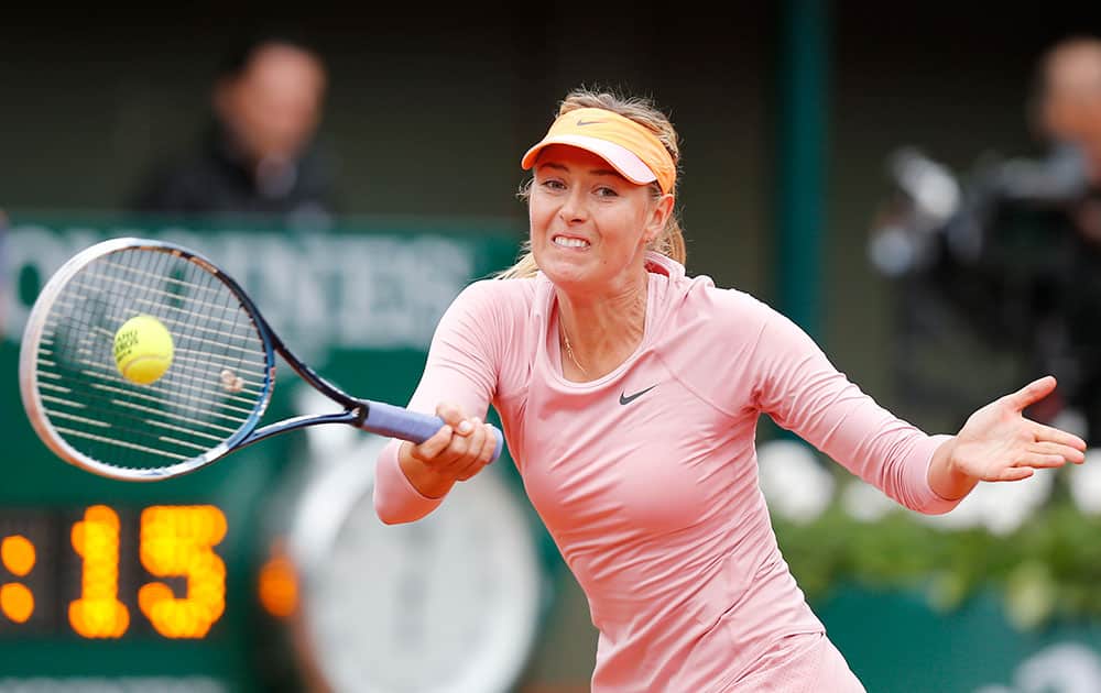 Russia's Maria Sharapova returns the ball to Bulgaria's Tsvetana Pironkova during the second round match of the French Open tennis tournament at the Roland Garros stadium, in Paris.