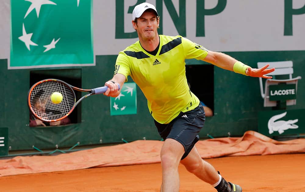 Britain's Andy Murray returns in his second round match of the French Open tennis tournament against Australia's Marinko Matosevic at the Roland Garros stadium, in Paris, France.