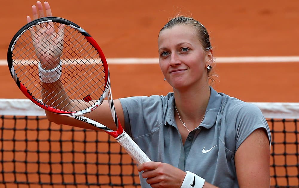 Petra Kvitova of the Czech Republic, waves after defeating New Zealand's Marina Erakovic in their second round match of the French Open tennis tournament at the Roland Garros stadium, in Paris, France. Kvitova won 6-4, 6-4.