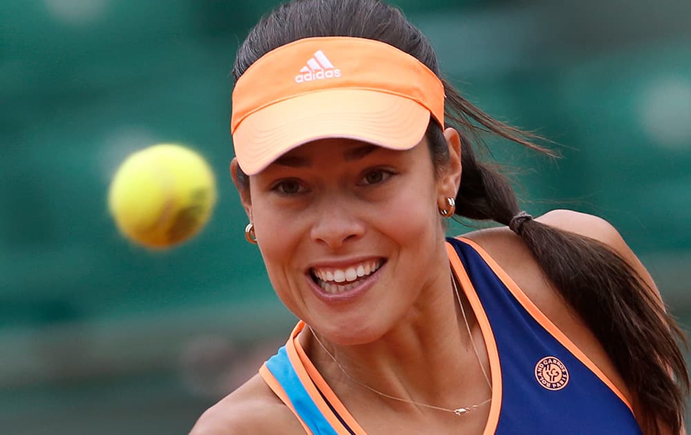 Serbia's Ana Ivanovic eyes the ball as she returns during the second round match of the French Open tennis tournament against Ukraine's Elina Svitolina at the Roland Garros stadium, in Paris, France.