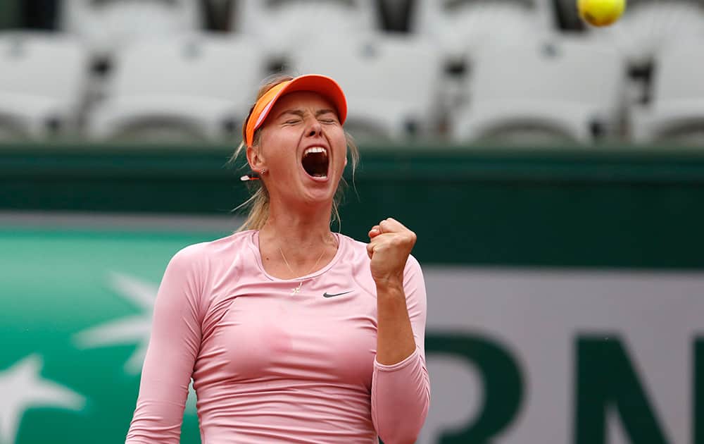 Russia's Maria Sharapova celebratesscoring a point during the fourth round match of the French Open tennis tournament against Australia's Samantha Stosur at the Roland Garros stadium, in Paris, France. Sharapova won in three sets 3-6, 6-4, 6-0.