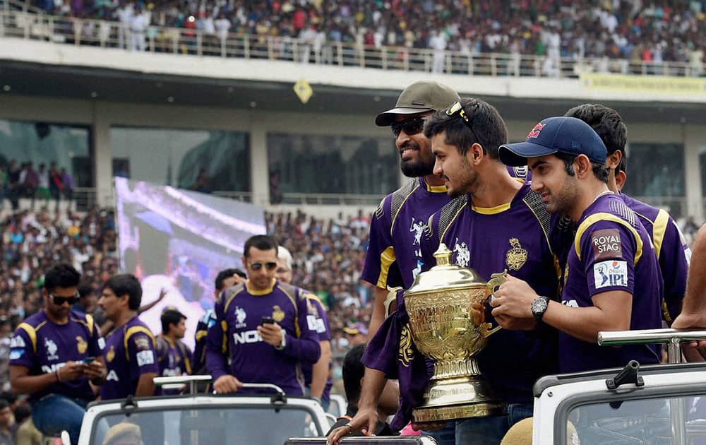 Kolkata Knight Riders players Gautam Gambhir, Sunil Narine and Yusuf Pathan during a felicitation ceremony for the team's victory at IPL - 7 tournament at Eden Garden in Kolkata.