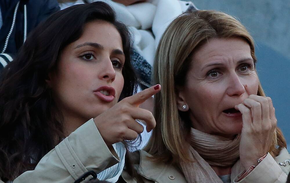 Maria Francisca Perello, girlfriend of Spain's Rafael Nadal, watches Nadal during the quarterfinal match of the French Open tennis tournament against France's Gael Monfils at the Roland Garros stadium, in Paris, France.