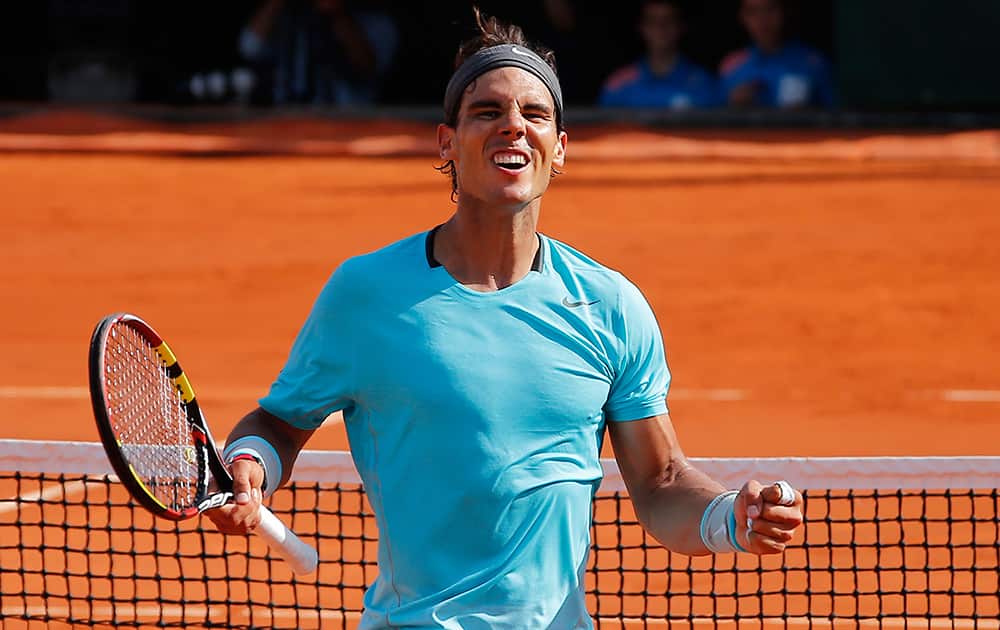 Spain's Rafael Nadal celebrates winning the semifinal match of the French Open tennis tournament against Britain's Andy Murray at the Roland Garros stadium, in Paris, France.