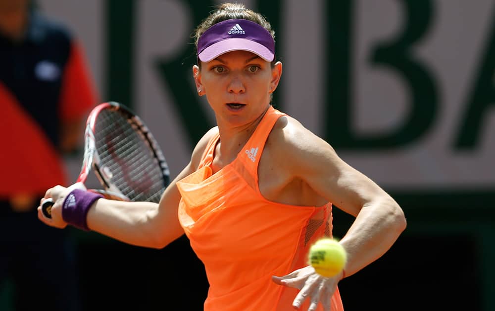 Romania's Simona Halep returns the ball during final of the French Open tennis tournament against Russia's Maria Sharapova at the Roland Garros stadium, in Paris.