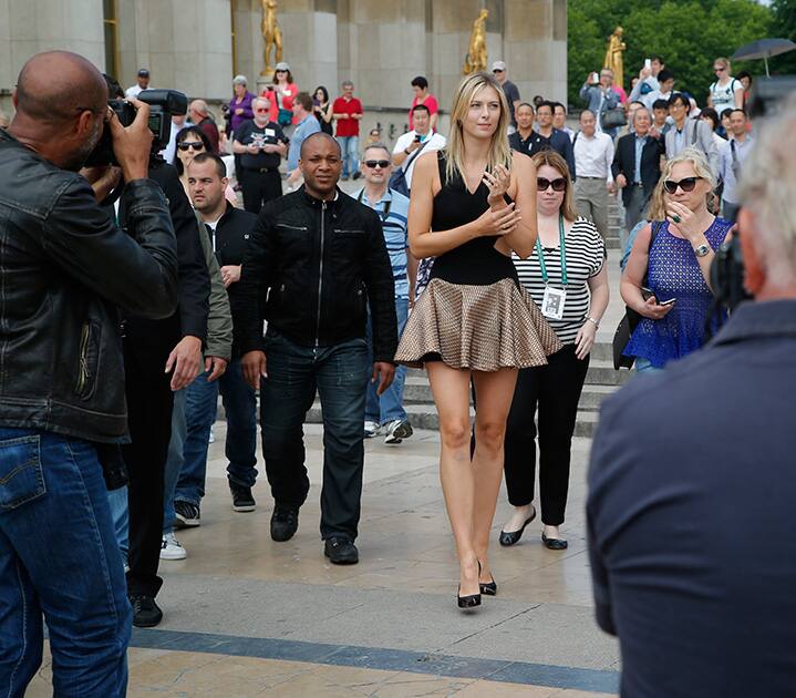 Russia's Maria Sharapova arrives at Trocadero Square prior to posing with the trophy in front of the Eiffel Tower, one day after defeating Romania's Simona Halep in the women's final of the French Open tennis tournament in Paris.