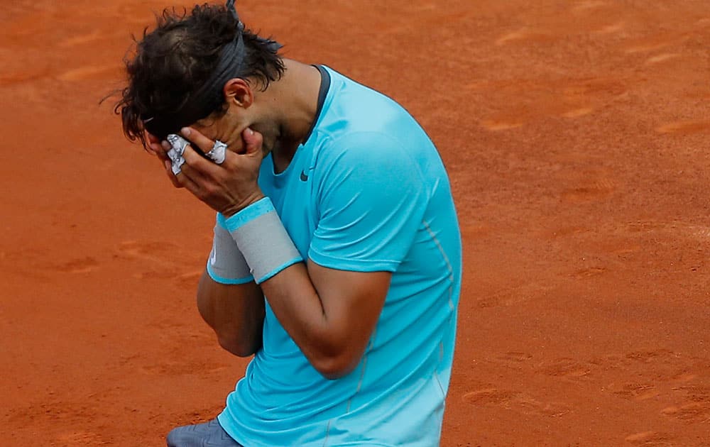 Spain's Rafael Nadal reacts as he defats Serbia's Novak Djokovic during their final match of the French Open tennis tournament at the Roland Garros stadium, in Paris.