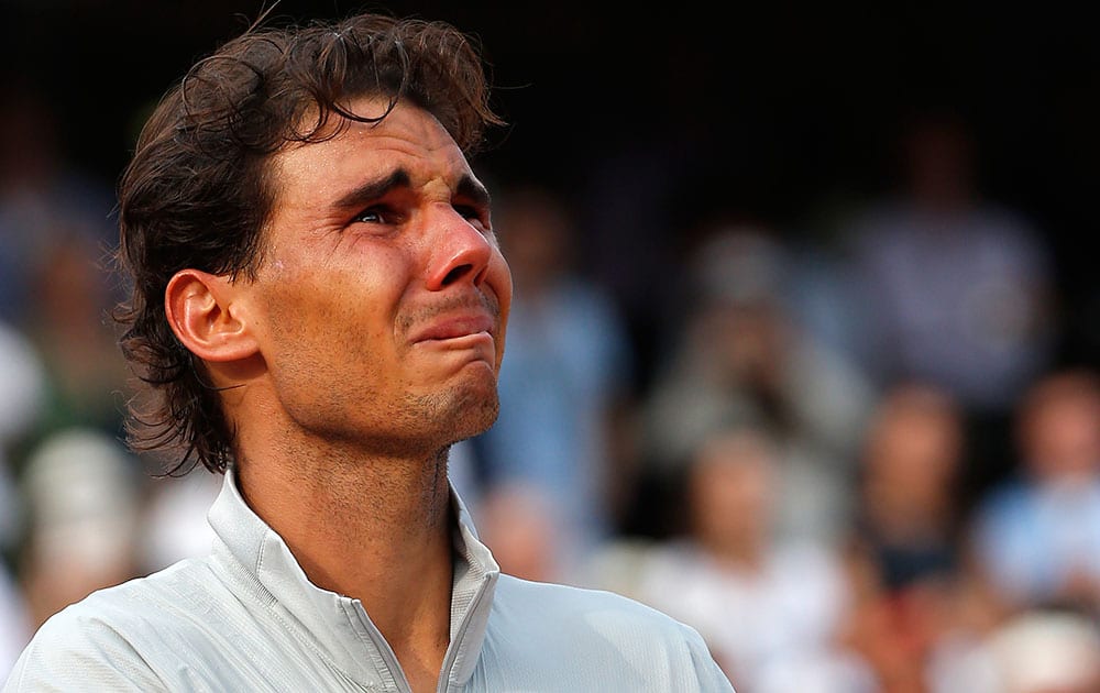 Spain's Rafael Nadal reacts on the podium after defeating Serbia's Novak Djokovic in their final match of the French Open tennis tournament at the Roland Garros stadium, in Paris.